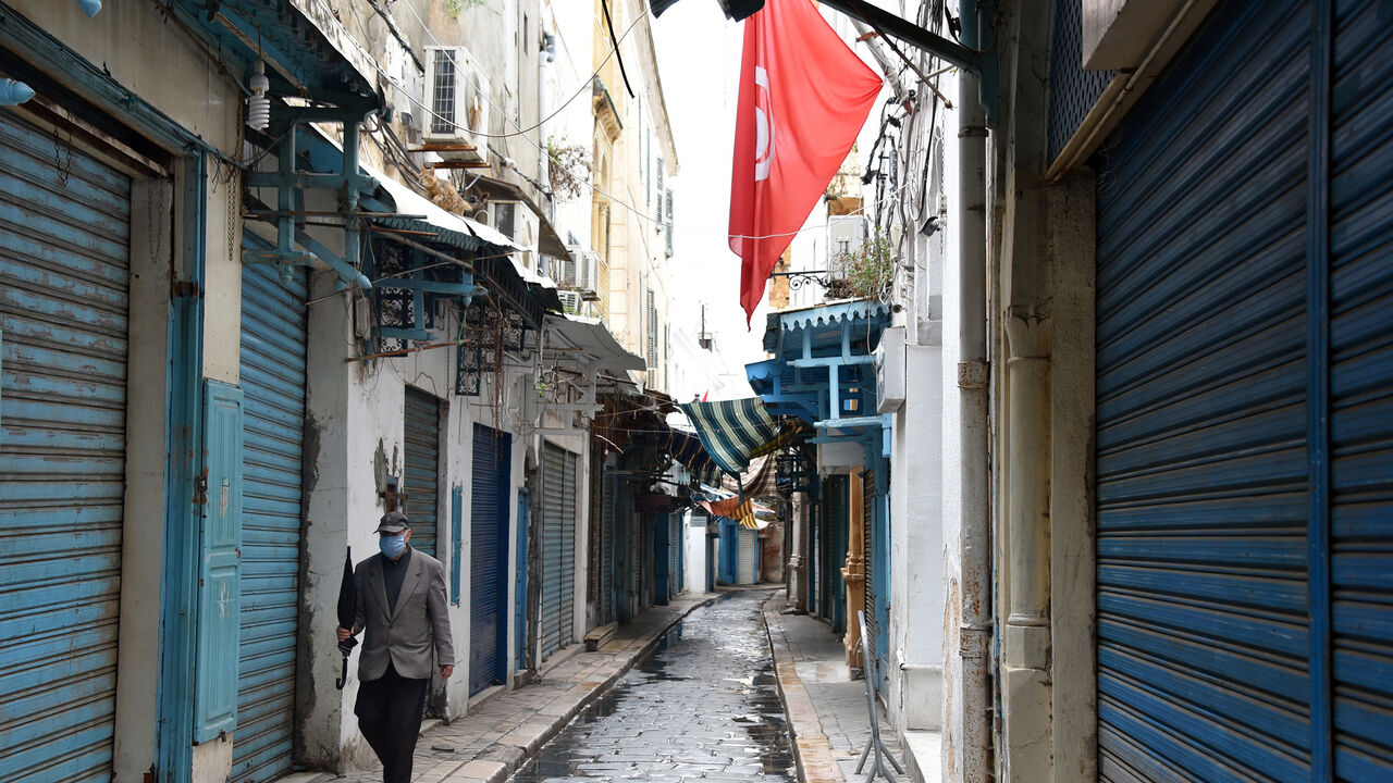 TUNIS, TUNISIA - 2020/04/20: A man wearing a protective face mask as a preventive measure against the spread of coronavirus walks through an alley of the souk in the Medina.
The lockdown imposed to help fight the spread of coronavirus pandemic in Tunisia has been extended for the 3rd time. Tunisia has recorded a total of 884 confirmed case, 148 recovered and 38 deaths by the corona virus disease. (Photo by Jdidi Wassim/SOPA Images/LightRocket via Getty Images)