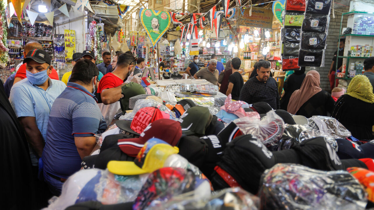 People shop after the lockdown measures, following the outbreak of the coronavirus disease (COVID-19), were partially eased, to prepare for the holy month of Ramadan, in Baghdad, Iraq, April 21, 2020. REUTERS/Khalid al Mousily - RC2Y8G9E0PGC