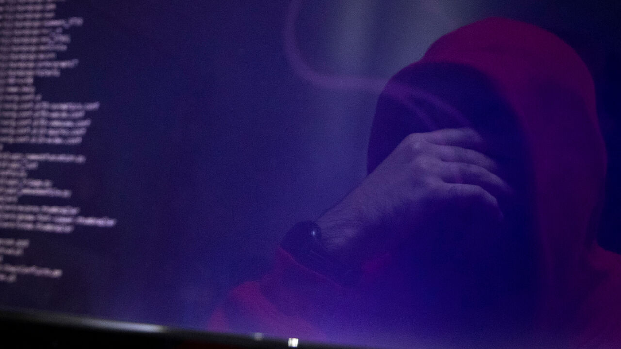 A man is reflected in a monitor as he takes part in a training session at Cybergym, a cyber-warfare training facility backed by the Israel Electric Corporation, at their training center in Hadera, Israel   July 8, 2019. Picture taken July 8, 2019. REUTERS/Ronen Zvulun - RC168E30C5C0