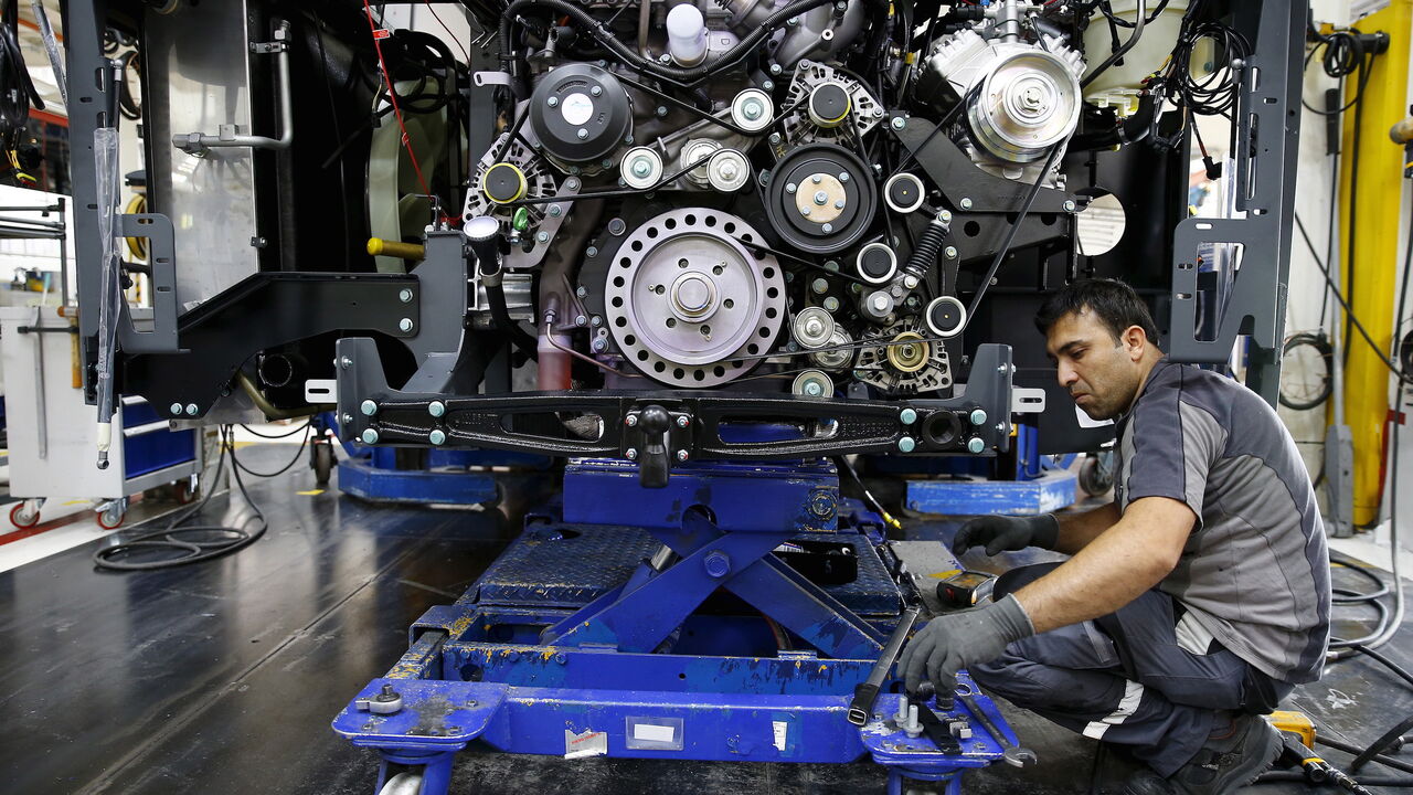 An employee works at the assembly line of the MAN Bus Production Center in Ankara, Turkey, July 29, 2015. According to a statement from the company, it employs 1,600 workers on the 320,000 square metre plant where seven vehicles are produced a day to be used for the MAN and NEOPLAN brand of city and intercity buses, as well as touring coaches. Picture taken July 29, 2015.  REUTERS/Umit Bektas   - GF20000008643