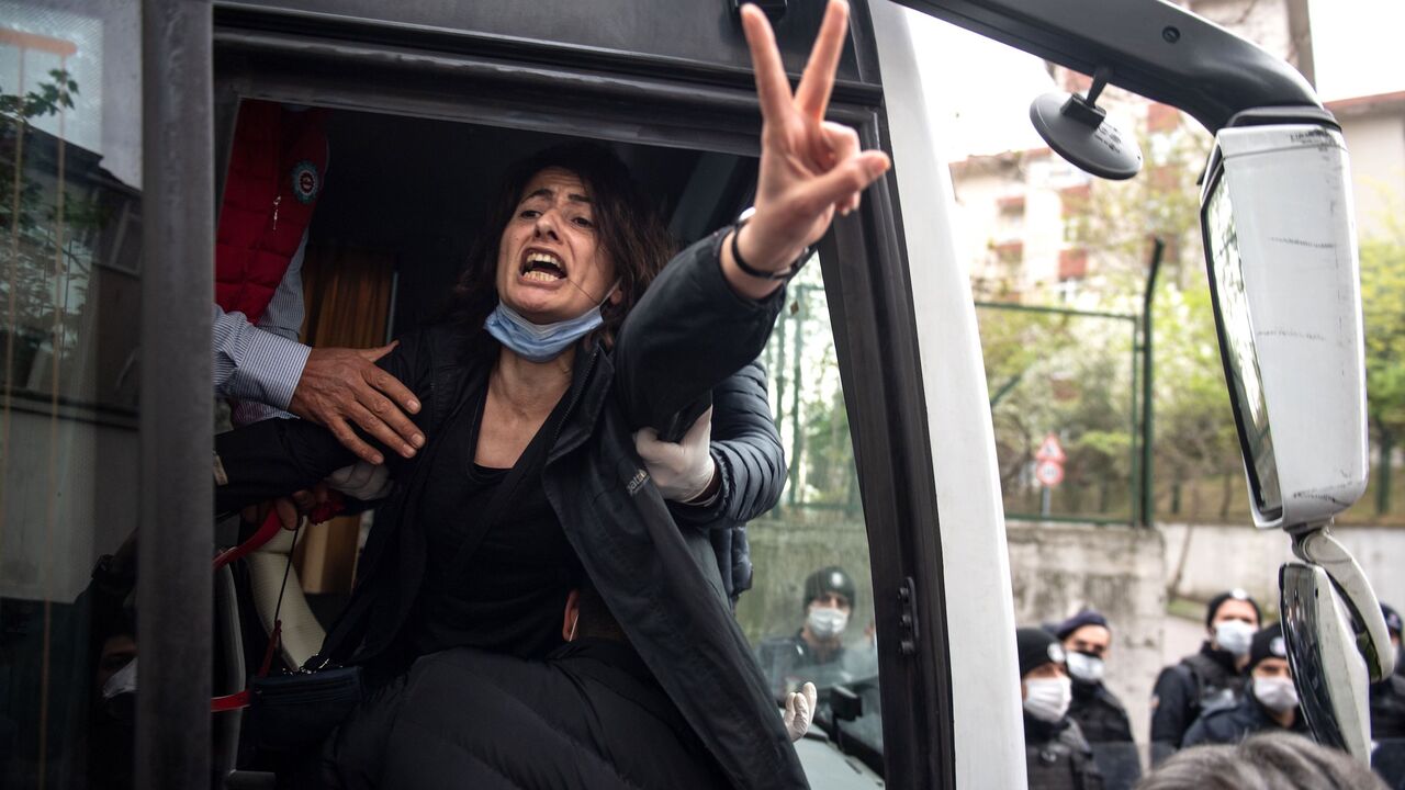 TOPSHOT - Police detain a demonstrator during a May Day rally marking the international day of the worker in Istanbul, on May 1, 2020, as the country tries to curb the spread of the coronavirus, COVID-19. - Police in Istanbul detained several demonstrators who tried to march toward Istanbul's symbolic Taksim Square to mark May Day in defiance of the lockdown imposed by the government due to the coronavirus outbreak. (Photo by Bulent Kilic / AFP) (Photo by BULENT KILIC/AFP via Getty Images)