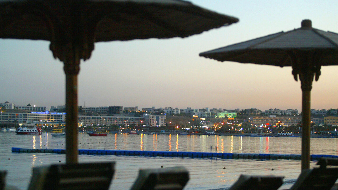 SHARM EL-SHEIKH, EGYPT - JULY 25: Empty deck chairs bear witness to what should have been a bustling beach at sunset on July 25, 2005 in the Egyptian Red Sea resort of Sharm el-Sheikh. With foreign tourists cutting short their holidays and tour operators cancelling flights after the weekend's bombings that killed at least 64 people, Egypt seems sure to suffer from a significant decrease in tourism, one of the country's major sources of foreign income. (Photo by Uriel Sinai/Getty Images)