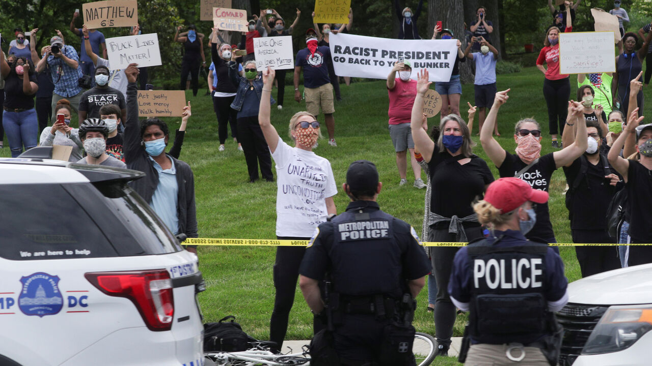 SENSITIVE MATERIAL. THIS IMAGE MAY OFFEND OR DISTURB Crowds of angry protestors line the motorcade route as seen from inside U.S. President Donald Trump's motorcade as he travels through Washington to visit the Saint John Paul II National Shrine as protests continue over the death in police custody of George Floyd, in Washington, U.S., June 2, 2020. REUTERS/Tom Brenner - RC241H90KOXZ