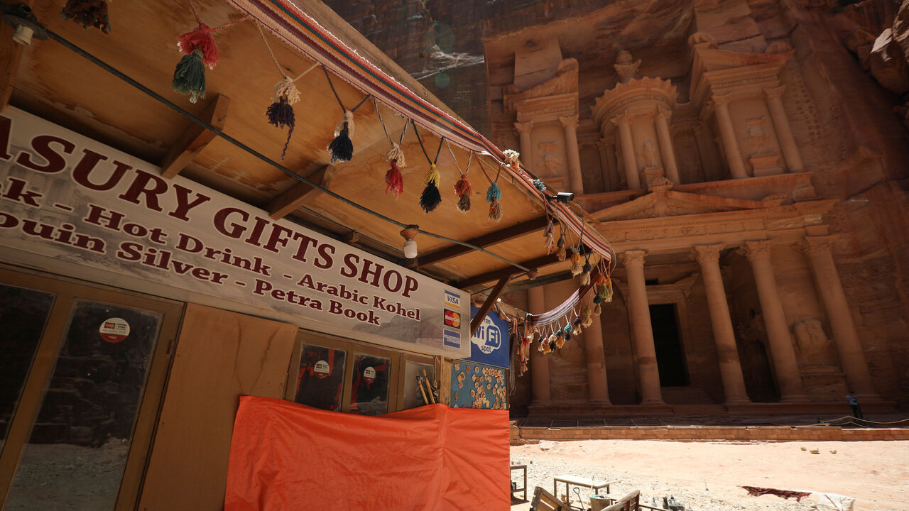 A closed souvenir shop in front of the treasury site in the ancient city of Petra is seen empty of tourists after the government closed all tourist facilities in the country amid concerns over the spread of the coronavirus disease (COVID-19), Jordan June 3, 2020. REUTERS/Muhammad Hamed - RC2V1H9EE04C