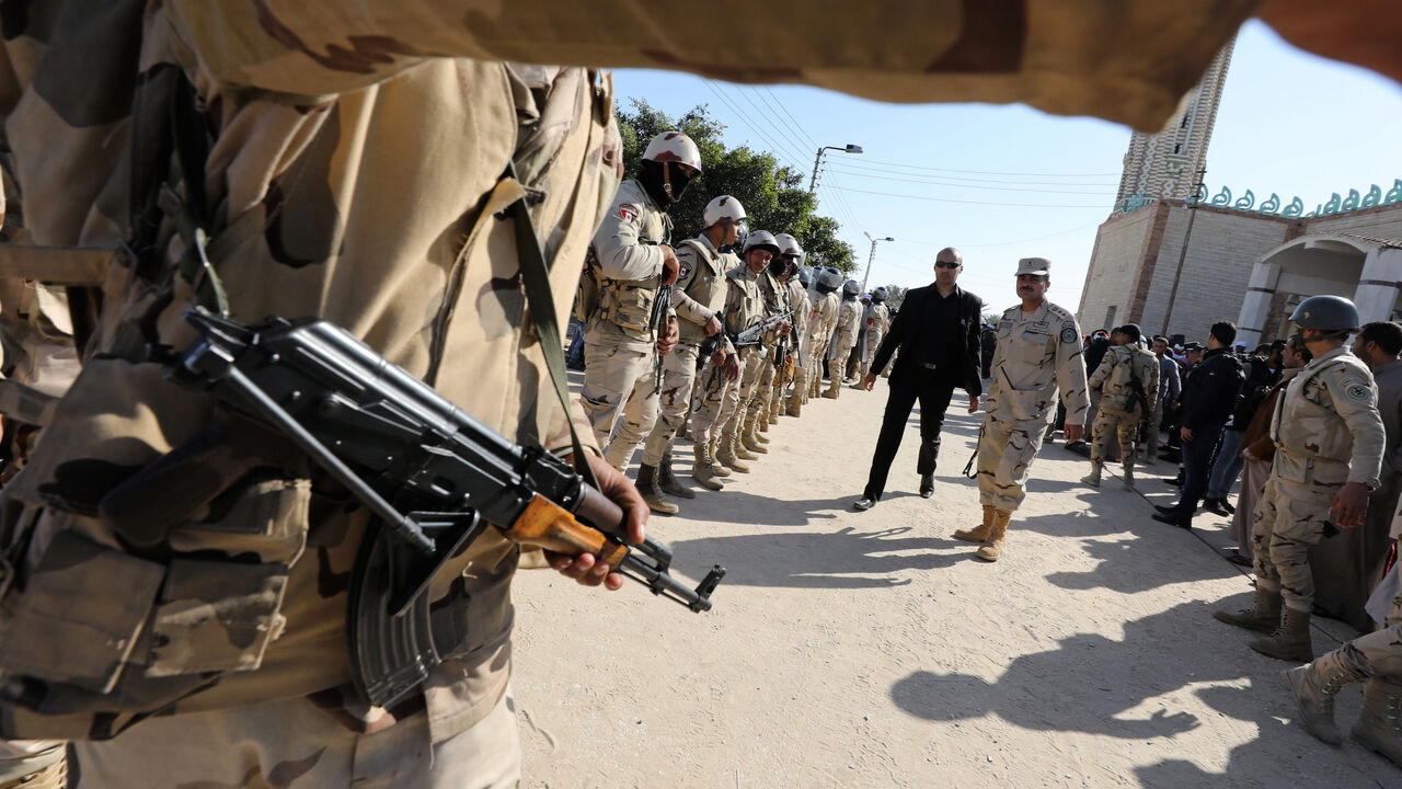 Military secure worshippers outside Al Rawdah mosque during the first Friday prayer after attack in Bir Al-Abed, Egypt, December 1, 2017. REUTERS/Mohamed Abd El Ghany - RC1E339A9500