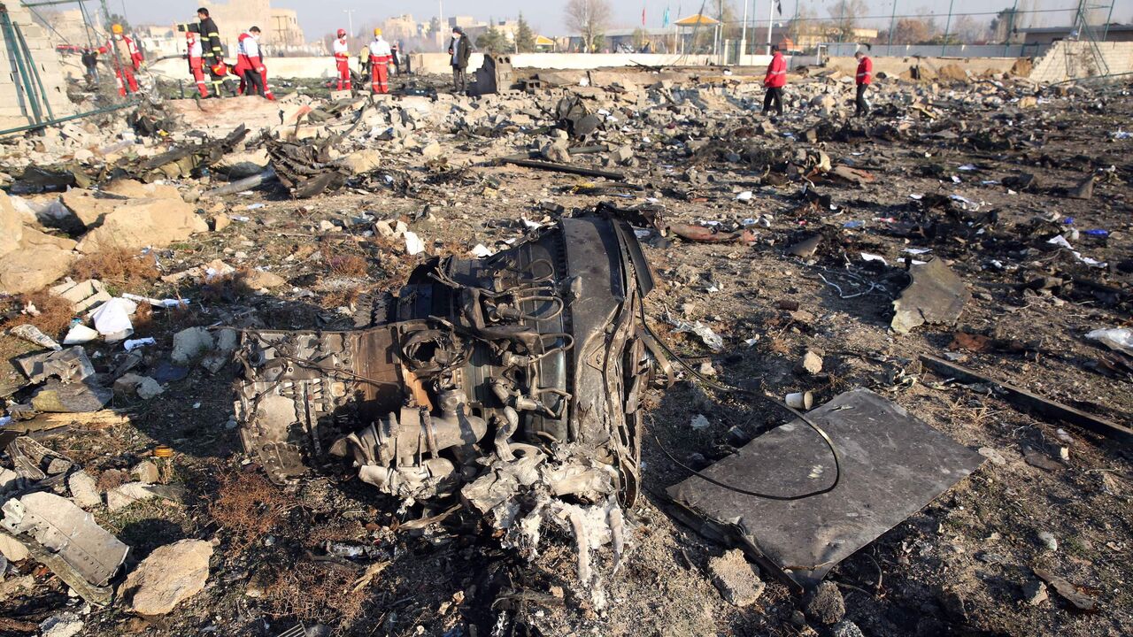 TOPSHOT - Rescue teams work at the scene after a Ukrainian plane carrying 176 passengers crashed near Imam Khomeini airport in the Iranian capital Tehran early in the morning on January 8, 2020, killing everyone on board. - All 176 people on board a Ukrainian passenger plane were killed when it crashed shortly after taking off from Tehran on January 8, Iranian state media reported. State news agency IRNA said 167 passengers and nine crew members were on board the aircraft operated by Ukraine International A