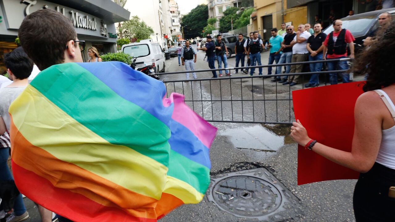 Activists from of the Lebanese LGBT community take part in a protest outside the Hbeish police station in Beirut on May 15, 2016, demanding the release of four transsexual women and calling for the abolishment of article 534 of the Lebanese Penal code, which prohibits having sexual relations that "contradict the laws of nature". / AFP / ANWAR AMRO        (Photo credit should read ANWAR AMRO/AFP via Getty Images)