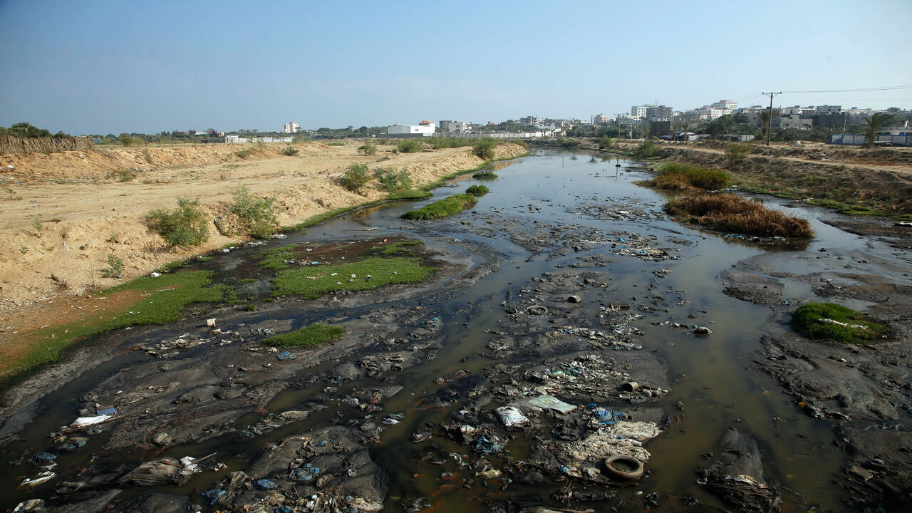 A photo taken on June 24, 2019 shows raw sewage flowing near the main Gaza Strip power plant, serving the Hamas-run Palestinian territory, south of Gaza City. - Finance officials were flying into Bahrain today for a US-led peace conference that holds out billions of dollars for the Palestinians, whose leaders pronounced the idea dead on arrival. (Photo by MOHAMMED ABED / AFP)        (Photo credit should read MOHAMMED ABED/AFP via Getty Images)
