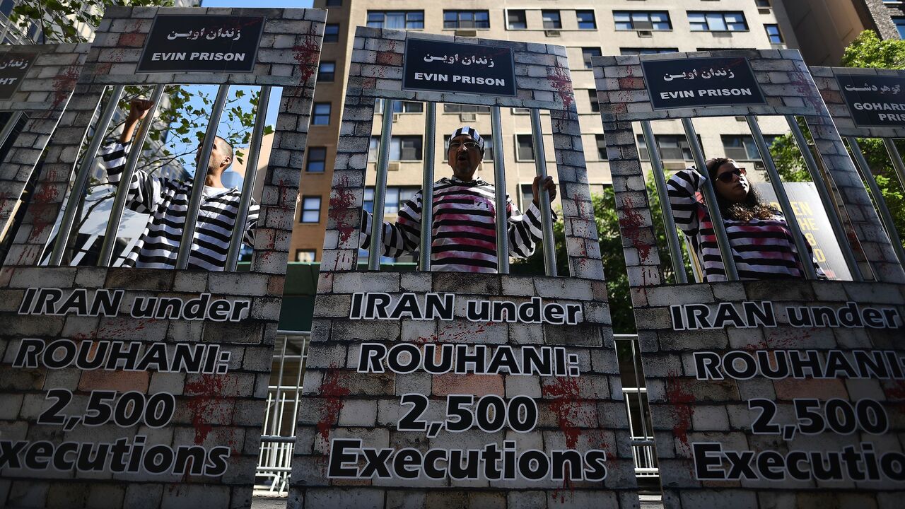 TOPSHOT - Demonstrators protest against Iran's President Hassan Rouhani outside the United Nations headquarters, where Rouhani addresses the 71st session of the United Nations General Assembly, in New York on September 22, 2016.  / AFP PHOTO / Jewel SAMAD        (Photo credit should read JEWEL SAMAD/AFP via Getty Images)