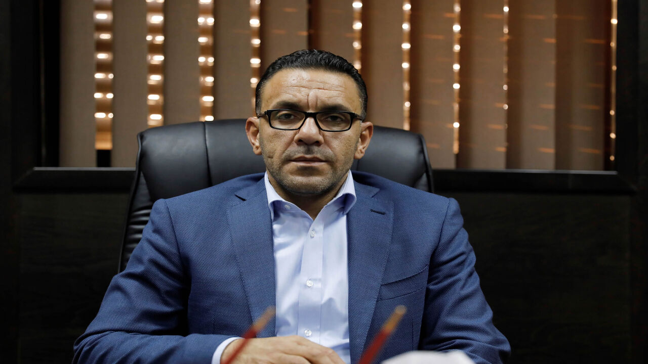 Governor of Jerusalem for the Palestinian Authority Adnan Ghaith poses for a photograph in his office at the Palestinian Ministry of Jerusalem affairs' headquarters in the occupied West Bank town of al-Ram, near Jerusalem, on November 4, 2018. - Israeli forces raided the offices of the Palestinian governor of Jerusalem on November 4, authorities said, after reports of an investigation related to a land sale. Israeli authorities confirmed the raid in Al-Ram, just on the other side of Israel's separation wall