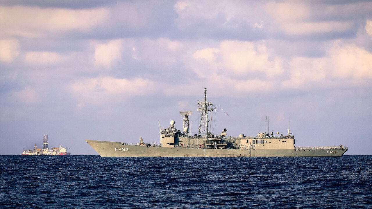 A picture taken on September 25, 2019 in the Mediterranean Sea, off the coast of Cyprus approximately 20 nautical miles (37 kilometers) north-west of Paphos, shows a Turkish army frigate, the TCG Gelibolu, (R) and the drilling vessel Fatih (L), which was deployed by Turkey to search for gas and oil in waters considered part of the EU state's exclusive economic zone (EEZ). (Photo by - / AFP)        (Photo credit should read -/AFP via Getty Images)