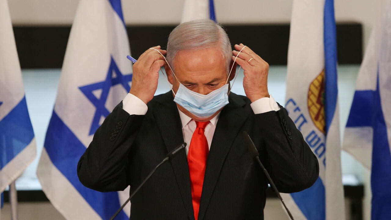 Israeli Prime Minister Benjamin Netanyahu during his visit to the Israeli city of Beit Shemesh near Jerusalem on September 8, 2020. - Once a role model in the fight against Covid-19, Israel decided to partially lock down several cities to slow the fast-spreading contagion as the government faces harsh criticism over the crisis. The government's ministerial committee on coronavirus decided to impose "a nightly closure" on 40 cities and towns with the highest infection rates, Prime Minister Benjamin Netanyahu