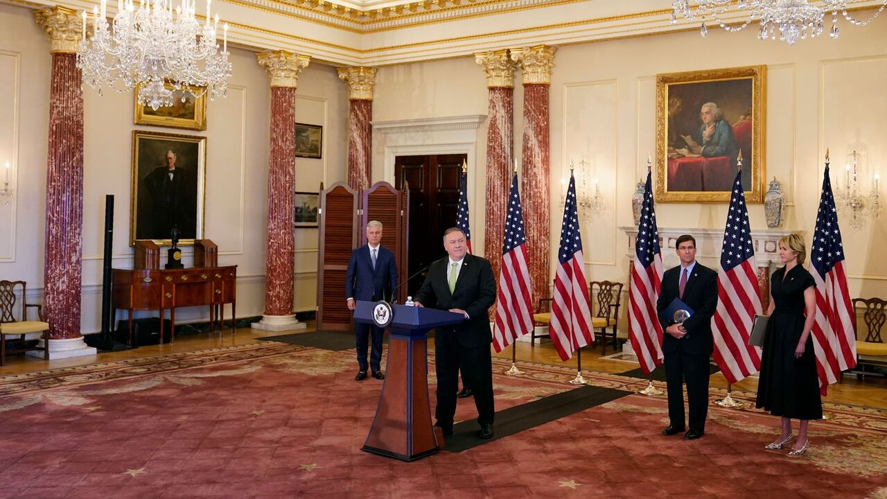 US Secretary of State Mike Pompeo speaks during a news conference to announce the Trump administration's restoration of sanctions on Iran, on September 21, 2020, at the US State Department in Washington,DC. - Standing behind Pompeo are (L-R), National security adviser Robert O'Brien, Defense Secretary Mark Esper and US Ambassador to the United Nations Kelly Craft. The United States said Monday it was imposing sanctions on Iran's defense ministry and Venezuelan President Nicolas Maduro under a UN authority w