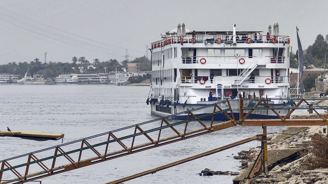 This picture taken on March 9, 2020 shows a view of the "A Sara" Nile cruise ship moored off the river bank of Egypt's southern city of Luxor, where 45 suspected COVID-19 coronavirus disease cases were detected and evacuated two days prior. - Egypt on March 8 reported the country's -- and Africa's -- first fatality from the virus, a 60-year-old German tourist who died in a Red Sea resort in eastern Egypt. The following day, Egypt's health ministry said the total number of known cases had risen to 55. Scores