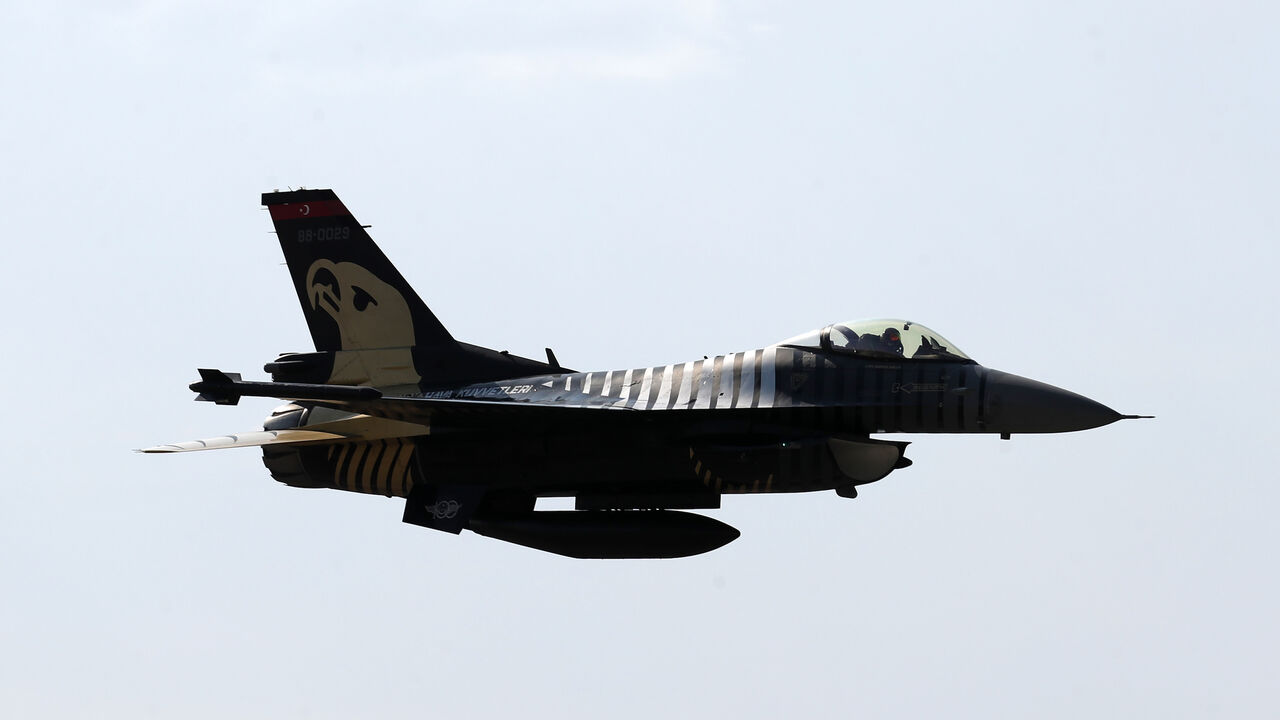 An acrobatic plane pilot performs with General Dynamics F-16 Solo Turk aerial aerobatic aircraft during the 5th Sivrihisar Airshow in Sivrihisar district of Eskisehir, in Turkey, on September 13, 2020. (Photo by Adem ALTAN / AFP) (Photo by ADEM ALTAN/AFP via Getty Images)