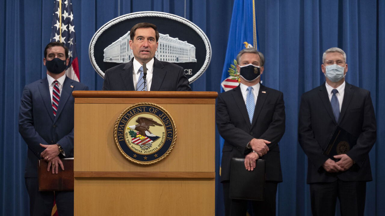 Assistant Attorney General John C. Demers(C) of the National Security Division, FBI Director Christopher Wray(2ndR),US Attorney for the Eastern District of Virginia G. Zachary Terwilliger(L) and Acting Assistant Director in Charge of the FBI Washington Field Office James A. Dawson(R) host a press conference on a national security matter at the Department of Justice in Washington, DC, on October 7, 2020. - Two members of an Islamic State cell dubbed the "Beatles" accused of killing several Western hostages a