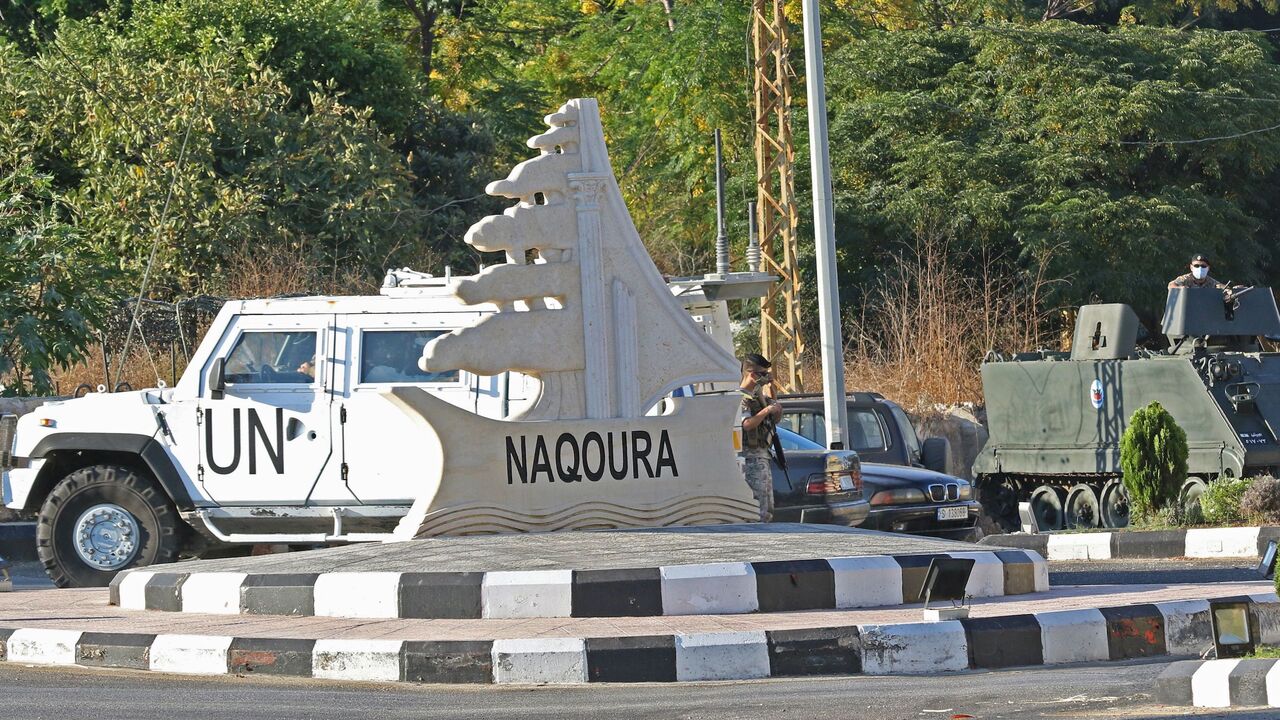 A picture taken on October 14, 2020 shows UNIFIL and Lebanese military vehicles guarding the area near the UNIFIL base (not seen in picture) where Israeli and Lebanese delegtaions were having their first round of talks on the demarcation of the maritime frontier between the two countries, which are technically in a state of war, in the southern Lebanese border town of Naqura on October 14, 2020. - Lebanon and Israel, still technically at war, began unprecedented talks sponsored by the United Nations and the