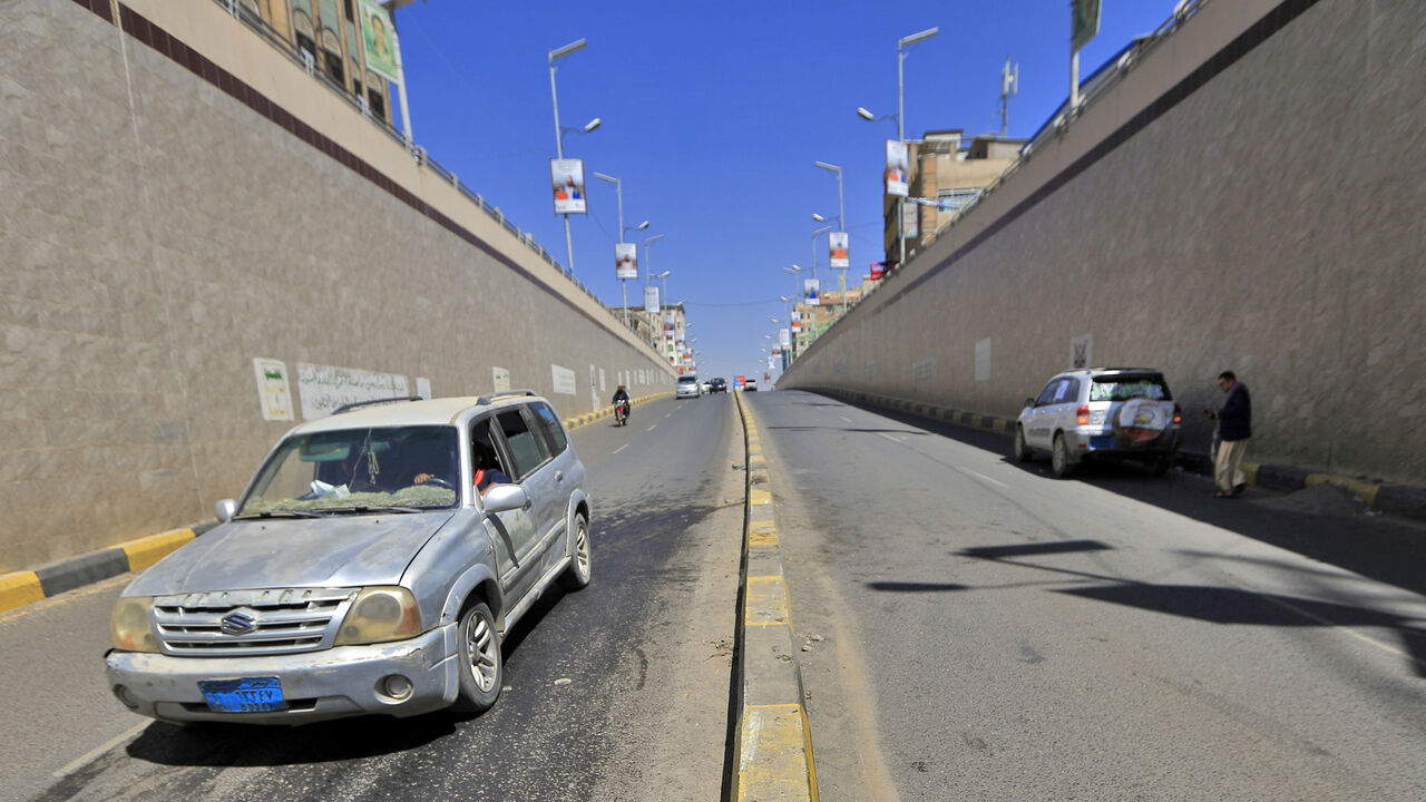A car passes by the site of the attack against Hassan Zaid, minister for youth and sports in Yemen's rebel Huthi administration, where he was shot dead by unidentified gunmen, in the Huthi-held capital Sanaa on October 27, 2020. - Unidentified gunmen shot the Huthi government minister as he drove his car, also wounding his daughter. Yemen is mired in civil war between Iran-backed Huthi rebels -- who control the capital but whose administration is not internationally recognised -- and a beleaguered governmen