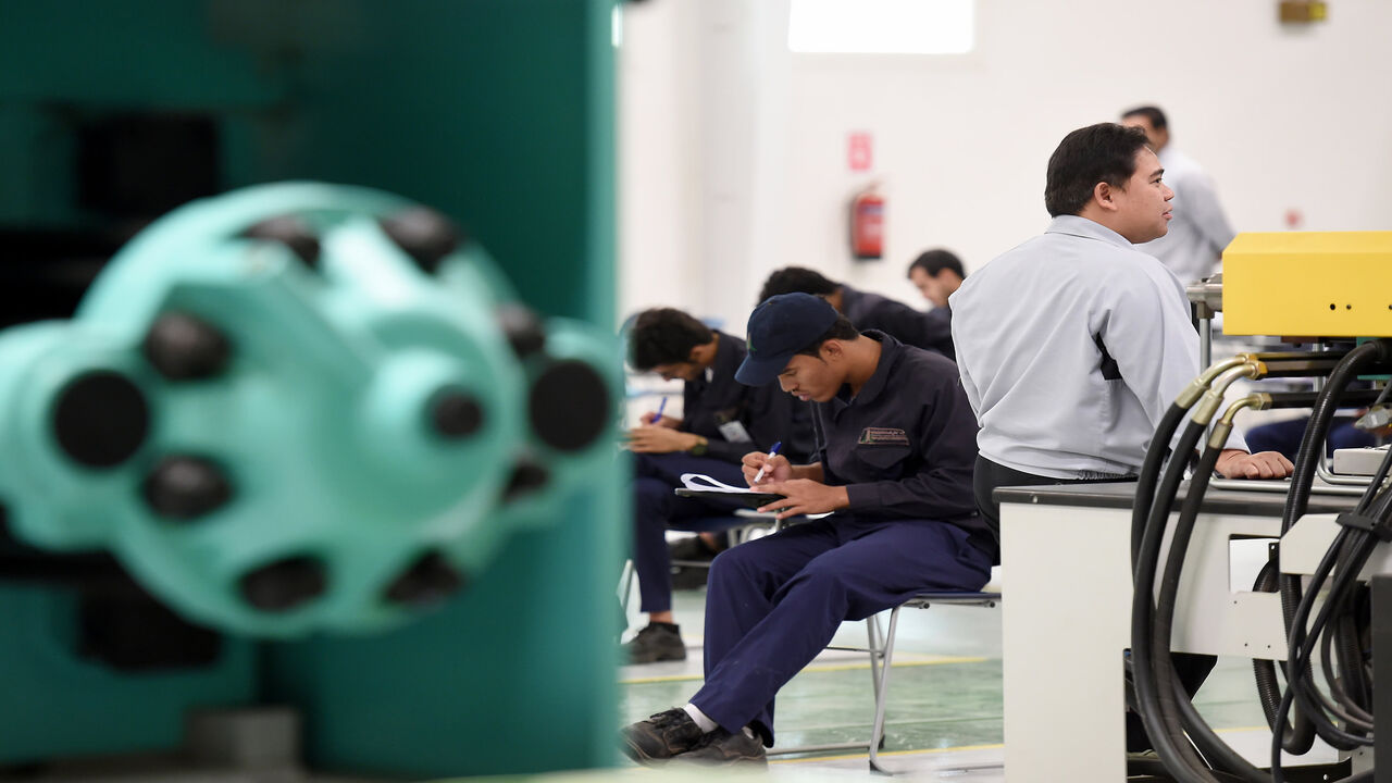 Saudi students pass their final exams at a workshop in the Higher Institute for Plastics Fabrication on June 13, 2016 in Riyadh. 
The students at the Higher Institute for Plastics Fabrication (HIPF) learn to manufacture plastic bags, pipes, bottles and other products, skills they immediately put to work in what the government says is a unique model. Reducing the kingdom's high unemployment rate is a foundation -- and major challenge -- of the government's wide-ranging Vision 2030 reform plan unveiled in Apr