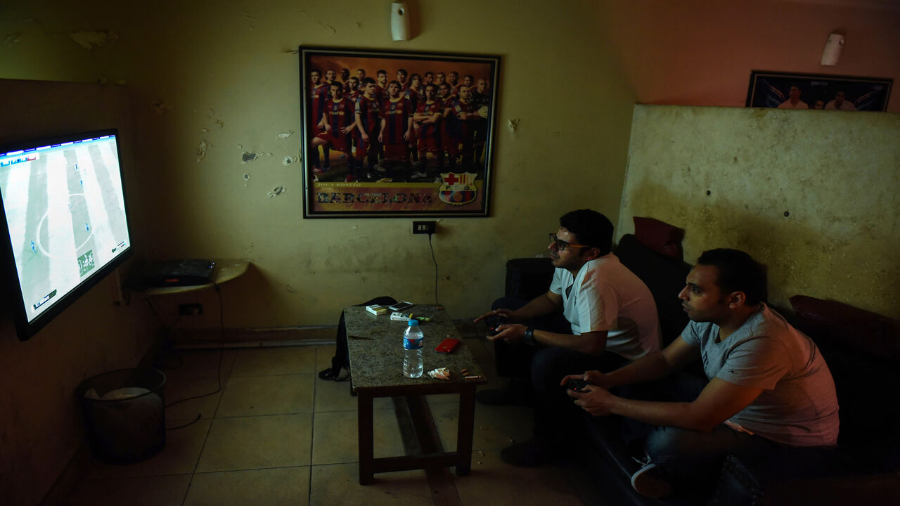 Unemployed Egyptian men play a video game at a cafe in the capital Cairo on October 8, 2015. North Africa and Middle East regions still have the highest unemployment rate in the world, according to a World Trade Organization (WTO) report published on October 8, 2015. AFP PHOTO  / MOHAMED EL-SHAHED        (Photo credit should read MOHAMED EL-SHAHED/AFP via Getty Images)