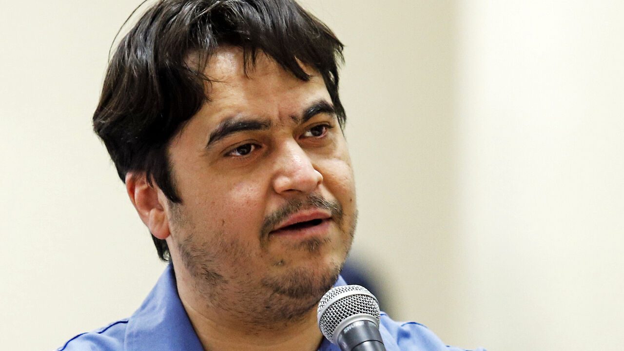 Ruhollah Zam, a former opposition figure who had lived in exile in France and had been implicated in anti-government protests, speaks during his trial at Iran's Revolutionary Court in Tehran on June 2, 2020. - Iran said it has sentenced to death Ruhollah Zam. The court has considered 13 counts of charges together as instances of 'corruption on earth' and therefore passed the death sentence, judiciary spokesman Gholamhossein Esmaili said. (Photo by ALI SHIRBAND / MIZAN NEWS / AFP) (Photo by ALI SHIRBAND/MIZA