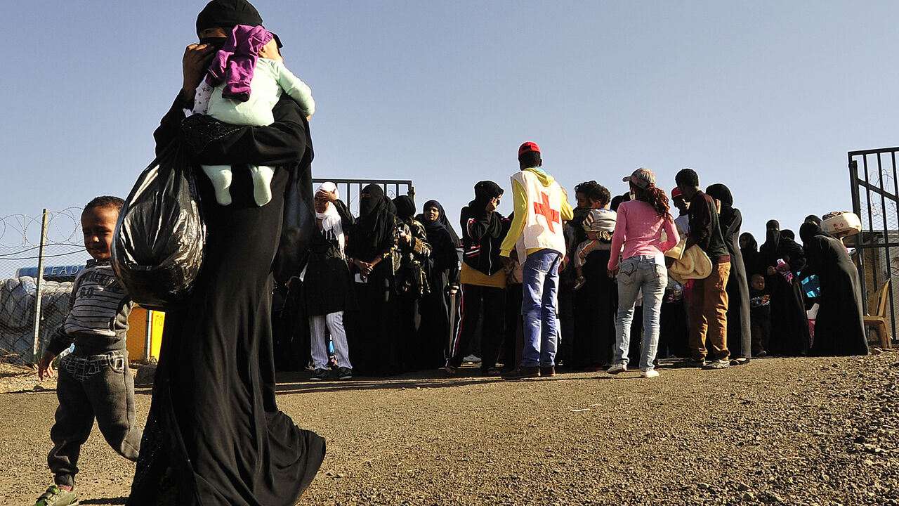 TO GO WITH AFP STORY BY JENNY VAUGHAN - Ethiopian immigrants returning from Saudi Arabia arrive at Addis Ababas Bole International Airport on December 10, 2013. Ethiopia has repatriated over 120,000 in the last month  the largest human airlift in recent history  after a seven-month amnesty period for undocumented Ethiopians expired last month, on December 10, 2013.  At least 150,000 in total are expected, though numbers continue to swell daily. Ethiopia said three of its citizens died in clashes with police