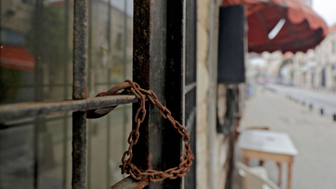A picture shows a closed shop in the city of Jounieh north ofBeirut on December 01, 2020. - Lebanon's economy is sinking into a "deliberate depression", the World Bank said on December 1 in a damning report stressing the authorities' failure to tackle the crisis. Lebanon's economy started collapsing last year as a result of years of corrupt practices and mismanagement. The crisis was made worse by a nationwide wave of anti-government protests that paralysed the country late last year and the Covid-19 pandem