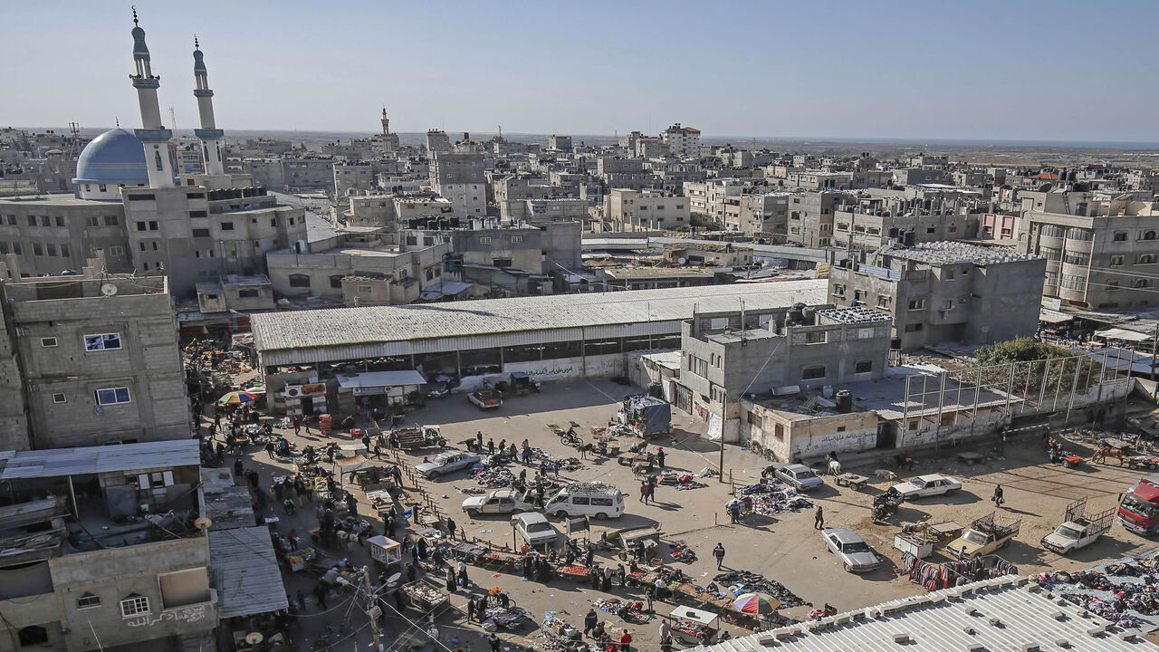 A general view taken on December 10, 2020 shows a crowded main square in Rafah, one day before a comprehensive lockdown was imposed on weekends in the southern Gaza Strip, as cases of infections with the coronavirus surged in the Palestinian coastal enclave. (Photo by SAID KHATIB / AFP) (Photo by SAID KHATIB/AFP via Getty Images)