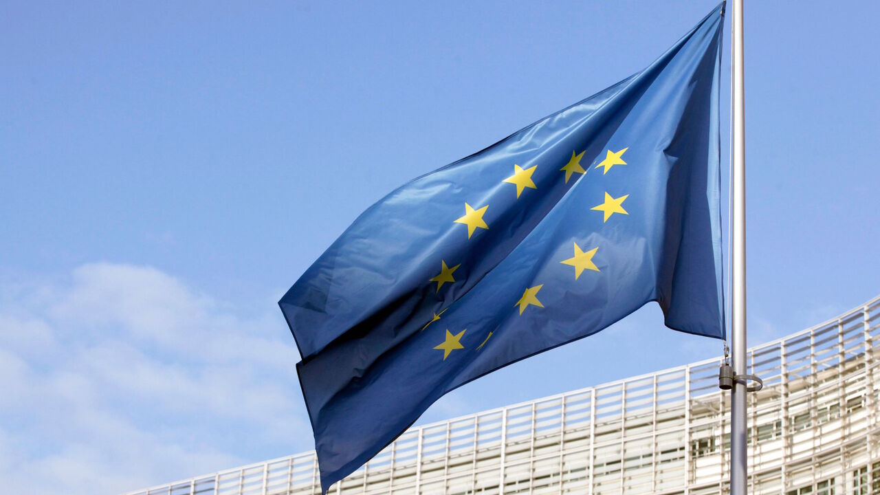 In this picture taken on December 25, 2020 a flag of the European Union can be seen fluttering outside the European commission headquarters in Brussels. (Photo by François WALSCHAERTS / AFP) (Photo by FRANCOIS WALSCHAERTS/AFP via Getty Images)