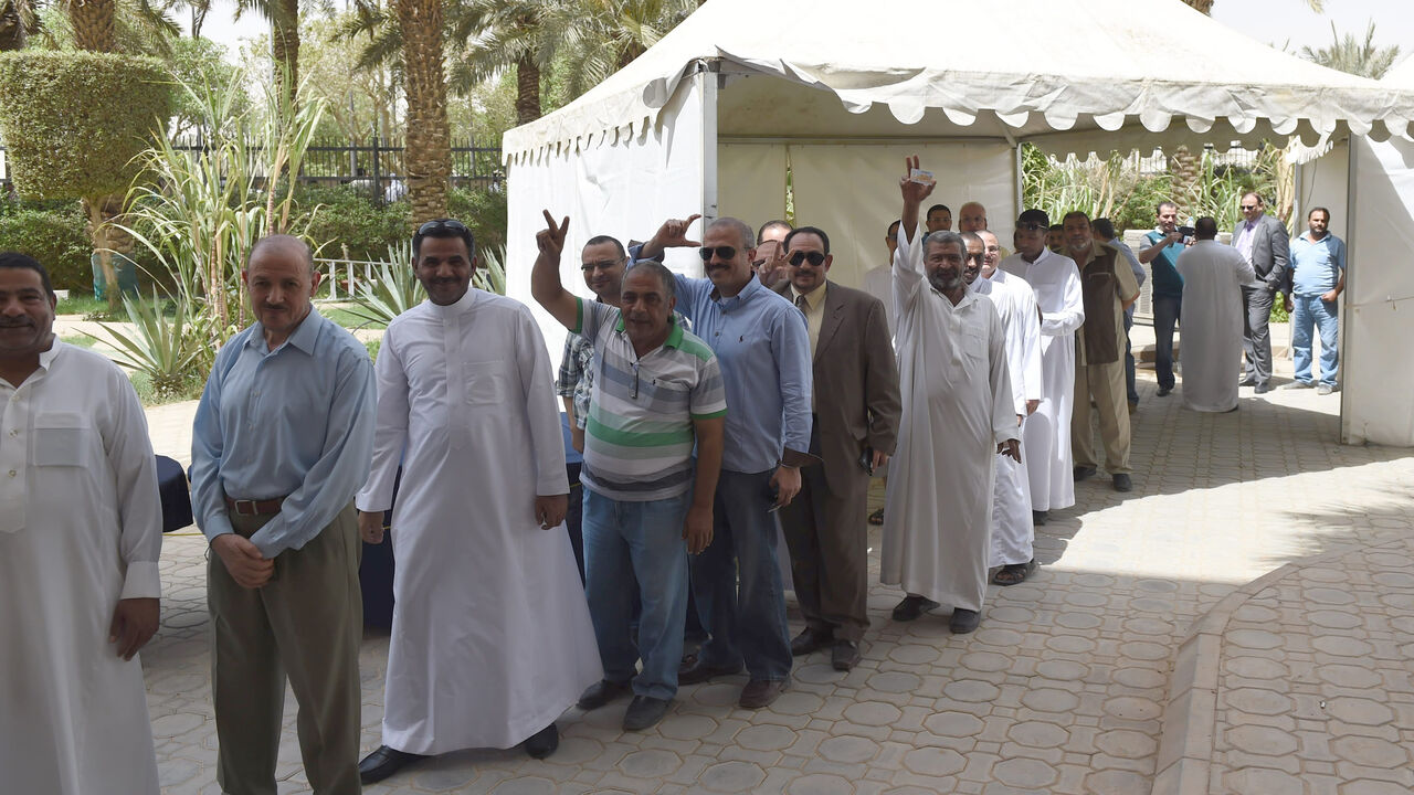 Egyptian men living in Saudi Arabia queue to casts their ballots in the early voting for the presidential elections on May 26-27, at the Egyptian embassy in Riyadh, on May 15, 2014. Egyptians abroad started voting in their country's first presidential elections since the military deposed Islamist president Mohamed Morsi nearly a year ago. Around 680,000 Egyptians, in 124 countries have registered to vote and have until May 18, to cast their ballots at diplomatic missions in their countries of residence, sta