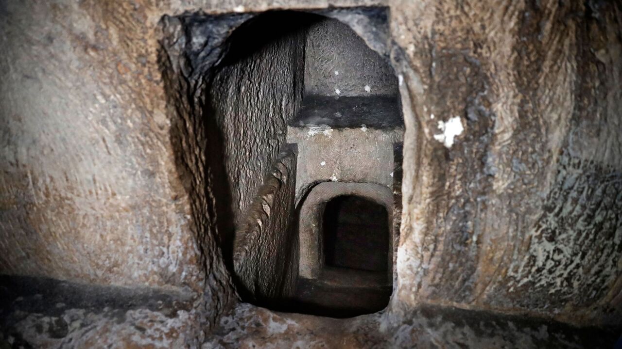 One of the several burial chambers of the Tombs of the Kings, owned and administered by the French Consulate of Jerusalem, is pictured on December 28, 2018 in East Jerusalem. - The ancient site, which is considered the grandest burial compound in the holy city and has been closed for years, includes a sophisticated burial cave that has a mechanism for sealing the entrance by means of a stone that rotates on a hinge. (Photo by THOMAS COEX / AFP)        (Photo credit should read THOMAS COEX/AFP via Getty Imag