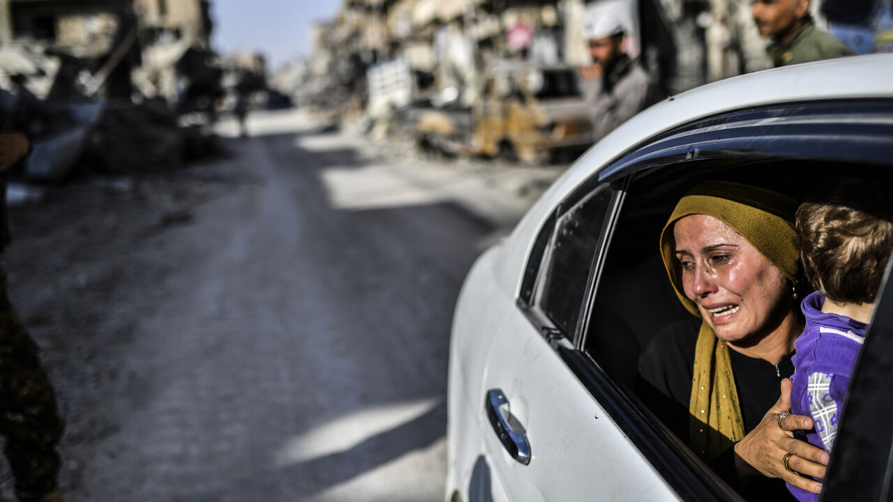 TOPSHOT - A woman cries as she looks at her house in Raqa on October 20, 2017, after a Kurdish-led force expelled the Islamic State group from the northern Syrian city.
For three years, Raqa saw some of IS's worst abuses and grew into one of its main governance hubs, a centre for both its potent propaganda machine and its unprecedented experiment in jihadist statehood.
 / AFP PHOTO / BULENT KILIC        (Photo credit should read BULENT KILIC/AFP via Getty Images)