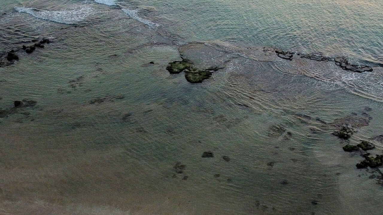 HADERA, ISRAEL - FEBRUARY 22:  An aerial view over Israel's coast line after an oil spill on February 22, 2021 in Hadera, Israel. Tar started washing up on the country's beaches last week, leading its interior minister to advise people to stay away from beaches. Authorities suspect the spill was caused by a leak from an offshore ship.  (Photo by Amir Levy/Getty Images)