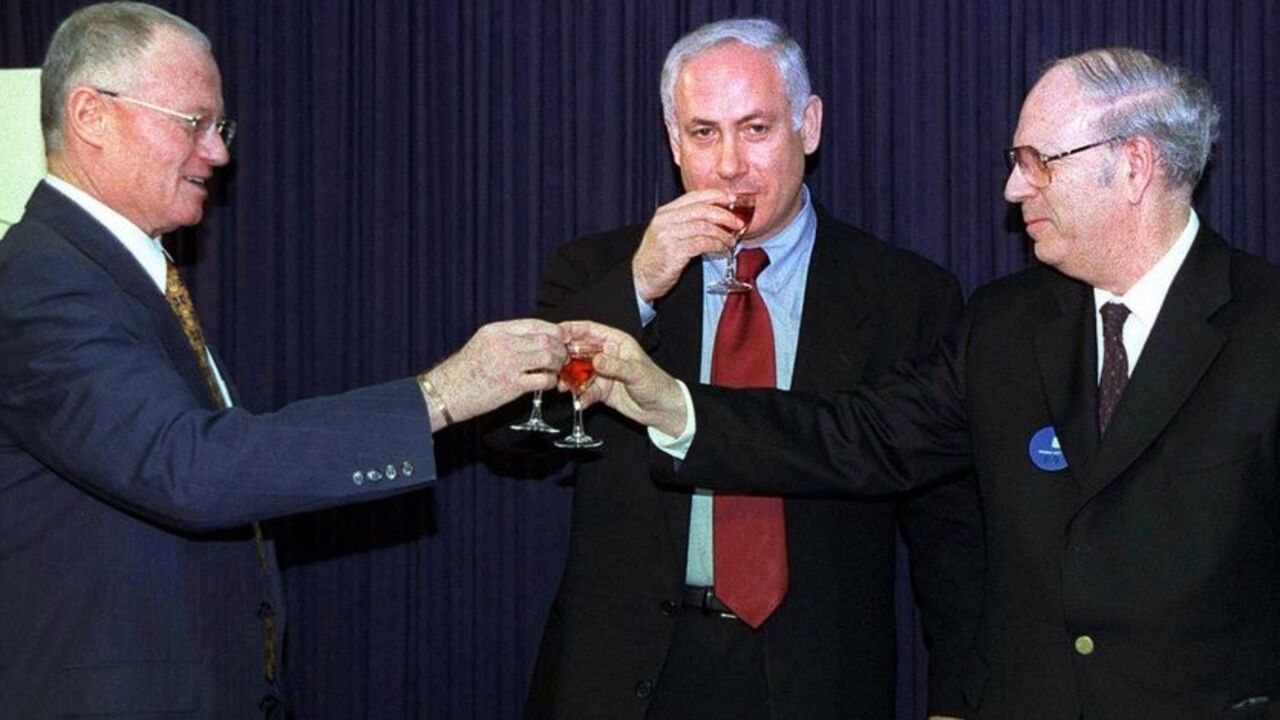 Prime Minister Benjamin Netanyahu (C) joins Efraim Halevy (R) who succeeds outgoing Mossad chief Danny Yatom (L) in a toast in the prime minister's offices during the Mossad handover ceremony April 8. Yatom resigned as Mossad spy chief in February amid scandals over botched missions in Jordan and Switzerland. Halevy, was born in 1934 in Britain and immigrated to Israel during the 1948 Arab-Israeli war that followed the creation of the State of Israel. He served as a former deputy Mossad chief and is expecte