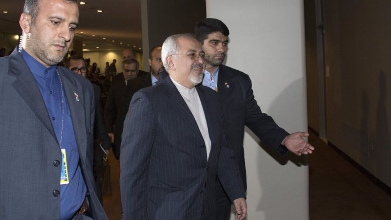 Iran's Foreign Minister Mohammad Javad Zarif (C) arrives to meet with the foreign ministers representing the permanent five member countries of the United Nations Security Council, including Germany, at UN Headquarters in New York September 26, 2013. Iran's new government began its first talks on its nuclear program with the United States and five other world powers on Thursday, with the Iranian foreign minister taking a seat next to U.S. Secretary of State John Kerry in a rare high-level contact between th