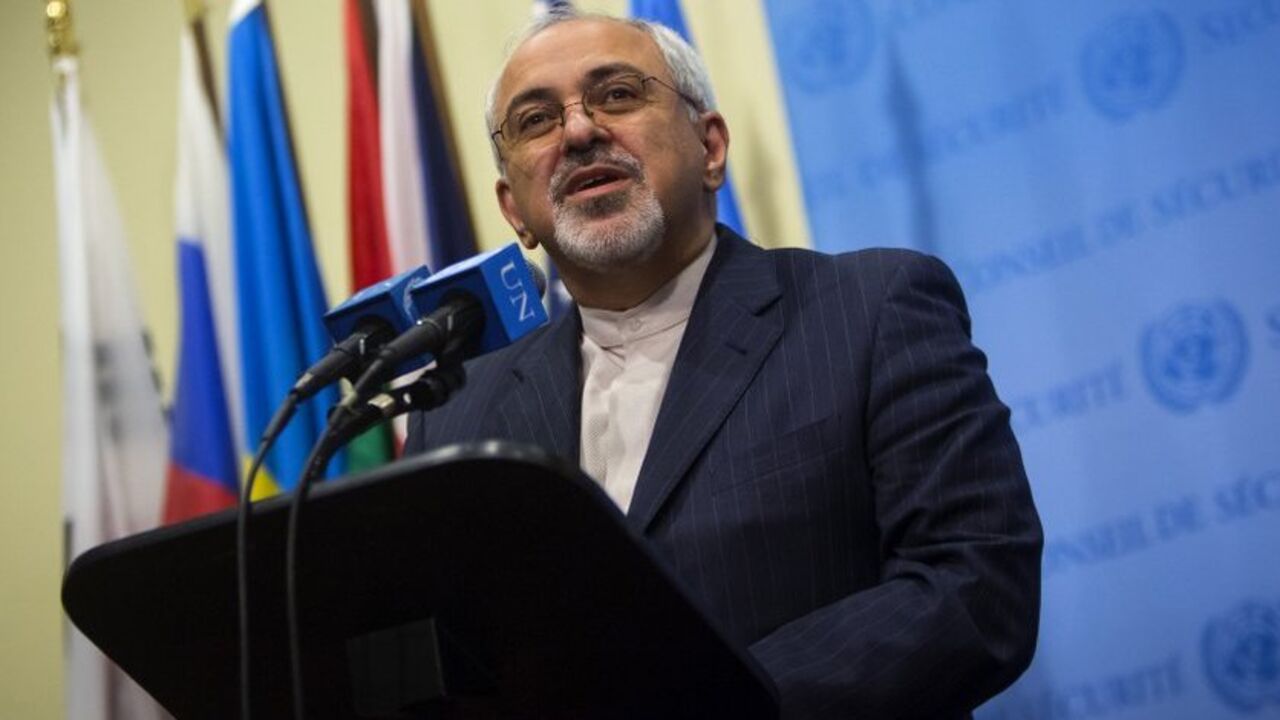 Iran's Foreign Minister Mohammad Javad Zarif speaks to the media after a meeting of the foreign ministers representing the permanent five member countries of the United Nations Security Council, including Germany, at the U.N. Headquarters in New York September 26, 2013. U.S. and Iranian officials emerged upbeat on Thursday from a meeting on Iran's nuclear program but both sides also sounded a cautionary note, with the United States saying there was more work to do and Iran insisting on quick sanctions relie