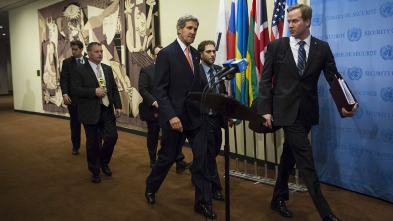 U.S. Secretary of State John Kerry (C) arrives at a meeting of the foreign ministers representing the permanent five member countries of the United Nations Security Council, including Germany, at the U.N. Headquarters in New York September 26, 2013. U.S. and Iranian officials emerged upbeat on Thursday from a meeting on Iran's nuclear program but both sides also sounded a cautionary note, with the United States saying there was more work to do and Iran insisting on quick sanctions relief. REUTERS/Eric Thaye