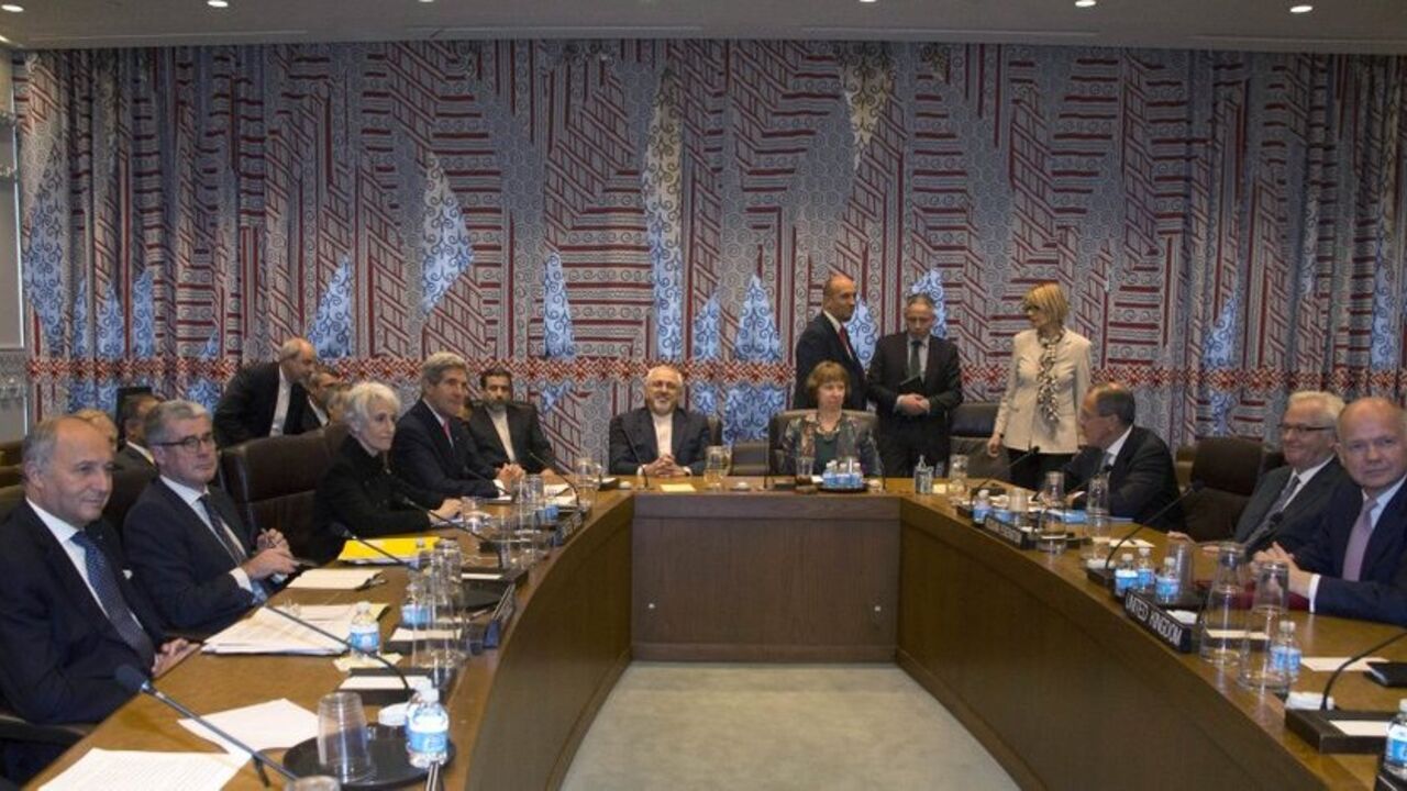 Seated at the table are French Foreign Minister Laurent Fabius (L), U.S. Secretary of State John Kerry (4th L), Iranian Foreign Minister Mohammad Javad Zarif (C), European Union foreign policy chief Catherine Ashton (4th R), Russian Foreign Minister Sergey Lavrov (3rd R) and British Foreign Secretary William Hague (R) during a meeting of the Foreign Ministers representing the permanent five member countries of the United Nations Security Council plus Germany on the sidelines of the UN General Assembly at th
