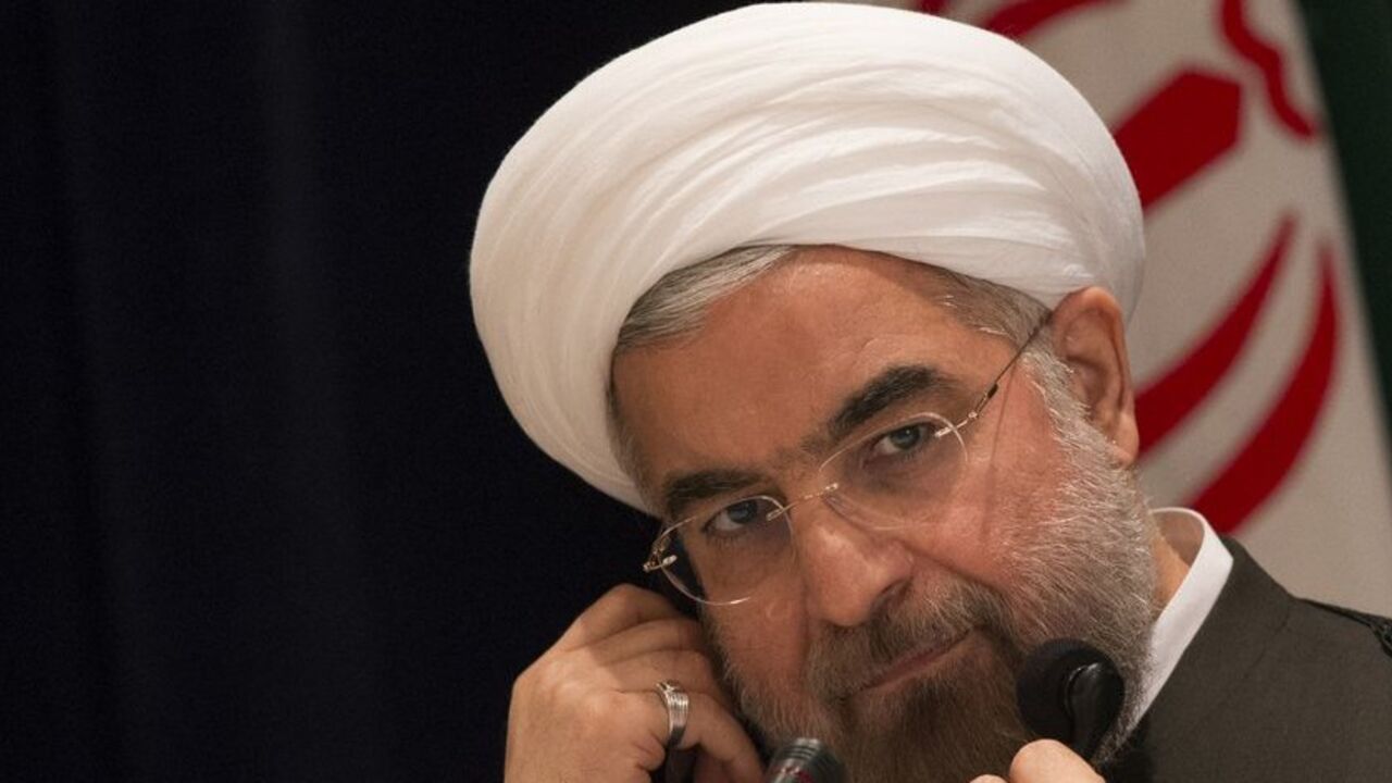 Iran's President Hassan Rouhani takes questions from journalists during a news conference in New York September 27, 2013. New Iranian President Rouhani said on Friday he wanted talks with major powers on Iran's nuclear program to yield results in a short period of time and that the improved mood in U.S.-Iranian relations could lead to better ties. REUTERS/Adrees Latif (UNITED STATES - Tags: POLITICS ENERGY) - RTX142CR