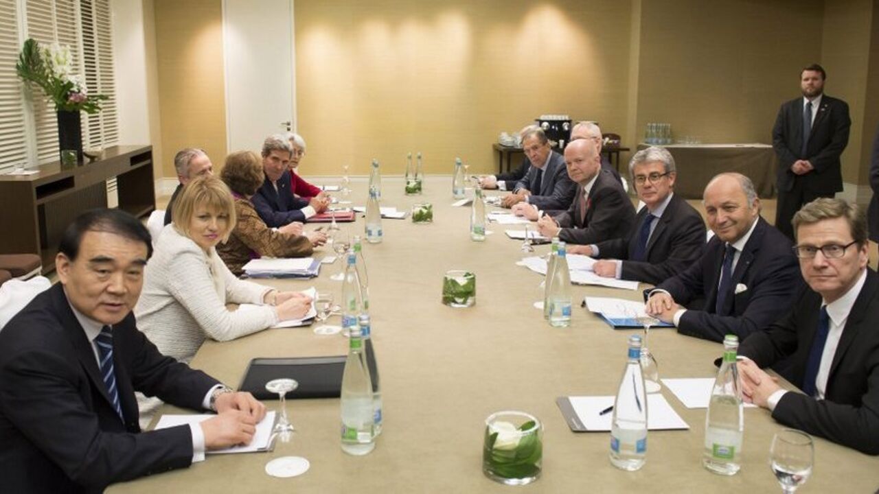 (L, front - back) Chinese Vice Foreign Minister Li Baodong, EU High Representative for Foreign Affairs Catherine Ashton, U.S. Secretary of State John Kerry, (R, front - back) Germany's Foreign Minister Guido Westerwelle, French Foreign Minister Laurent Fabius, British Foreign Secretary William Hague and Russian Foreign Minister Sergei Lavrov, speak together during the third day of closed-door nuclear talks at the Intercontinental Hotel in Geneva, November 9, 2013. Barring a last-minute breakthrough, talks b