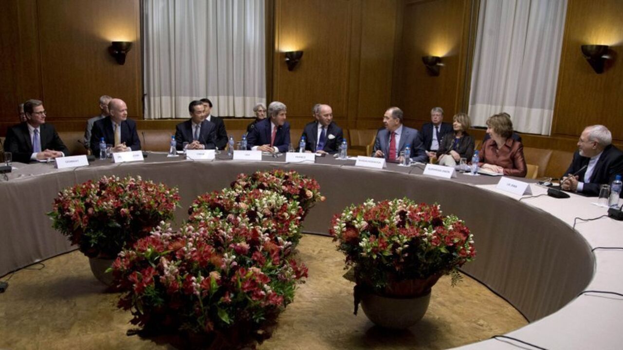 (L-R) Germany's Foreign Minister Guido Westerwelle, British Foreign Secretary William Hague, Chinese Foreign Minister Wang Yi, U.S. Secretary of State John Kerry,  French Foreign Minister Laurent Fabius, Russia's Foreign Minister Sergei Lavrov, EU foreign policy chief Catherine Ashton and Iranian Foreign Minister Mohammad Javad Zarif gather at the United Nations Palais in Geneva November 24, 2013. Iran and six world powers reached a breakthrough deal early on Sunday to curb Tehran's nuclear programme in exc