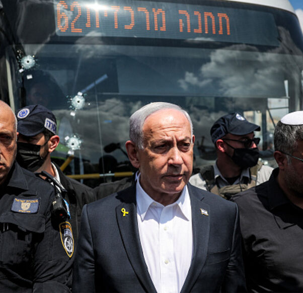TOPSHOT - Israel's Prime Minister Benjamin Netanyahu (C) and National Security Minister Itamar Ben-Gvir (R) visit the scene of a shooting at the Ramot road junction in Israeli-annexed east Jerusalem on September 8, 2025. Palestinian gunmen opened fire at a bus stop in Israeli-annexed east Jerusalem on September 8, killing five people and wounding several others. Israeli emergency service Magen David Adom (MDA) said there were five victims dead in the shooting attack, updating an earlier toll of four. Police