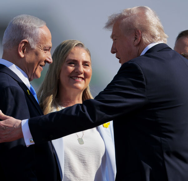 TEL AVIV, ISRAEL - OCTOBER 13: U.S. President Donald Trump (2R) is welcomed by Israeli Prime Minister Benjamin Netanyahu (L) at Ben Gurion International Airport on October 13, 2025 in Tel Aviv, Israel. President Trump is visiting the country hours after Hamas released the remaining Israeli hostages captured on Oct. 7, 2023, part of a US-brokered ceasefire deal to end the war in Gaza. (Photo by Chip Somodevilla/Getty Images)