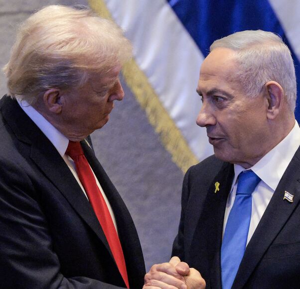 US President Donald Trump speaks with Israeli Prime Minister Benjamin Netanyahu at the Israeli parliament, the Knesset, in Jerusalem on Oct. 13, 2025.