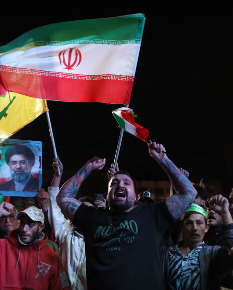 TOPSHOT - Iranians react after a ceasefire announcement at the Enqelab square, in Tehran, on April 8 2026. The United States and Iran agreed to a two-week ceasefire Tuesday barely an hour before US President Donald Trump's deadline to obliterate the rival country was set to expire, with Tehran to temporarily reopen the vital Strait of Hormuz. (Photo by AFP via Getty Images) /