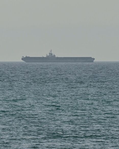 A ship is seen off the coast of Ras al-Khaimah, the day after the failure of US-Iran peace talks on April 13, 2026. The failure of US-Iran peace talks has left the US president with several unpalatable options, as analysts say his order to blockade the strategic Strait of Hormuz could further complicate his next move on April 12, 2026. Any hopes that the US vice president would emerge from the marathon day of negotiations with top Iranian officials with a deal to end a war that has rippled across the Middle