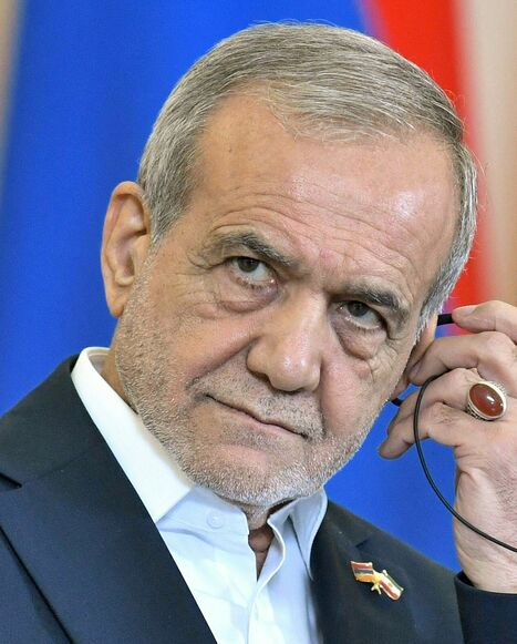 Iranian President Masoud Pezeshkian listens during a joint press conference alongside Armenia's Prime Minister in Yerevan on August 19, 2025.