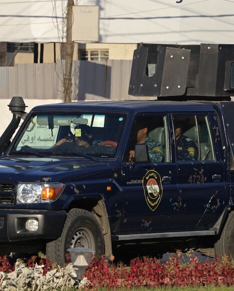 aqi security personnel patrol in a vehicle along a street in Baghdad on June 28, 2026.