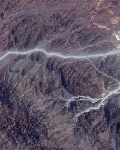 FILE PHOTO: A satellite view shows tunnel entrances at Pickaxe Mountain, of the Natanz nuclear facility, near Natanz, Iran, June 30, 2026. Vantor/Handout via REUTERS/File Photo