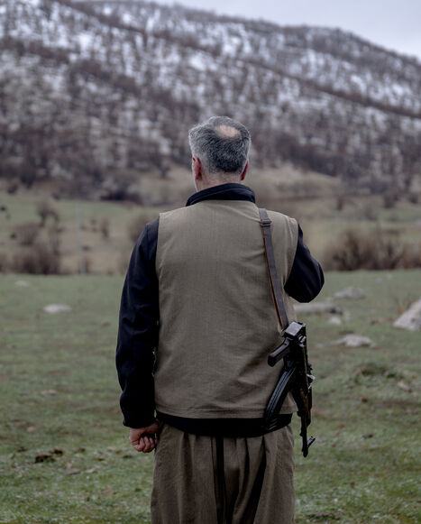 A Kurdish fighter from the Iranian Kurdish armed faction Kurdistan Free Life Party (PJAK) stands with his rifle at a site near the Iraqi border with Iran in Iraq's autonomous Kurdistan region, on March 8, 2026. 